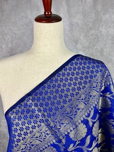 Beautiful Royal Blue Color Dupatta with Floral Jaal design in Muted Gold with Black Tassels. Perfect Gift !! Very Light Weight Item: DupattaBase color : Royal Blue Fabric : Semi Silk (Not Pure Silk)Work : Zari Weaved with tasselsLength of the Dupatta : 96 inches approx.Width of the dupatta : 38 inches (Approx.)Store Policies- No return or exchange will be accepted for color variations.- No return or exchange will be accepted if the color does not match your other clothing or your partners or any Blue Traditional Patterned Blouse Piece For Wedding, Blue Traditional Pattern Blouse Piece For Weddings, Blue Blouse Piece With Traditional Patterns For Wedding, Blue Wedding Blouse With Traditional Patterns, Blue Traditional Wear With Woven Motifs For Ceremonies, Elegant Blue Blouse Piece With Traditional Patterns, Elegant Blue Blouse With Traditional Patterns, Blue Blouse Piece With Motifs For Puja, Blue Bollywood Traditional Wear With Woven Motifs