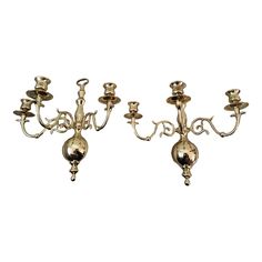 three antique brass candelabra with candlesticks