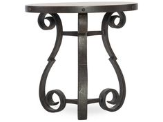 an iron table with a marble top and scroll design on the bottom, against a white background