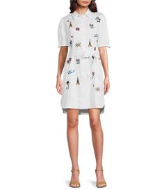 From KARL LAGERFELD PARIS&#x2C; this dress features:printed stretch cotton poplin fabrication collared neckline short sleevesbutton front closure approx. 38" length cotton/spandex dry clean Imported. Trendy Cotton Shirt Dress For Workwear, Trendy Cotton Knee-length Shirt Dress, Trendy Short Sleeve Summer Shirt Dress, Spring Cotton Shirt Dress With Spread Collar, Trendy White Workwear Dress, Trendy Cotton Short Sleeve Shirt Dress, Trendy White Dress For Work, Spring Preppy Knee-length Dress, Trendy White Collared Shirt Dress