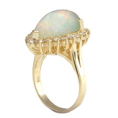 Stamped: 14K Yellow GoldTotal Ring Weight: 5.5 GramsRing Length: N/ARing Width: N/AGemstone Weight: Total Natural Opal Weight is 5.08 Carat (Measures: 17.40x11.04 mm)Color: MulticolorDiamond Weight: Total Natural Diamond Weight is 0.90 CaratColor: F-G, Clarity: VS2-SI1Face Measures: 21.81x16.55 mmSku: [702605W] Formal 14k Gold Oval Opal Ring, Formal Oval Cabochon Opal Ring Fine Jewelry, Gold Pear-shaped Opal Ring For Formal Occasions, Formal 14k Gold Opal Ring, Classic Multi-stone Opal Ring For Formal Occasions, Luxury 14k Stamped Opal Ring For Formal Occasions, Formal 14k Gold Multi-stone Opal Ring, Elegant 14k Stamped Opal Formal Ring, Formal Yellow Gold Opal Ring With Round Cut