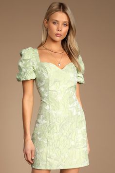 The Lulus Beyond Amazing Light Green Floral Jacquard Puff Sleeve Dress is next-level chicness! Woven jacquard fabric, with a textured floral design throughout, shapes this dress that has a sweetheart neckline and puffy short sleeves. The princess-seamed bodice carries into an A-line mini skirt. Hidden back zipper/clasp. Fit: This garment fits true to size. Length: Mid-thigh. Size medium measures 33" from top to bottom. Bust: Great for any cup size. Waist: Fitted - very fitted at natural waist. H Modest Homecoming Dresses, Short Green Dress, Floral Dress Outfits, Light Green Dress, Recruitment Outfits, Green Homecoming Dresses, Cute Floral Dresses, Formal Dresses With Sleeves, Guest Attire