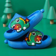 Dinosaur Slide Sandals: Adventure & Comfort Wrapped into One Looking to take your little ones on an adventure they won’t soon forget? Give them our Jurassic Adventure Dinosaur Slide Sandals and watch their faces light up! Perfect for toddlers and preschoolers who seek comfort, support and fun, these dinosaur-themed slide sandals feature fun, vibrant colors and soft, padded straps. Let your mini explorers conquer any adventure with confidence. Unique Design = Maximum Comfort We've designed these Playful Non-slip Sandals For Outdoor, Playful Non-slip Outdoor Sandals, Blue Non-slip Plastic Sandals, Playful Round Toe Sandals For Outdoor, Green Non-slip Sandals For Play, Green Non-slip Sandals For Playtime, Non-slip Green Sandals For Playtime, Kids Sandals Summer, Dino Footprint