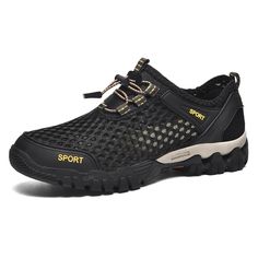 a pair of black and yellow shoes with the word sport written on the soles