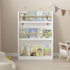 a baby's room with toys and bookshelves