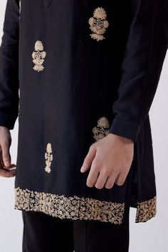 Black short chanderi kurta with placement floral dori embroidery and mandarin collar. Paired with slim fit pant.
Component: 2
Pattern: Embroidered
Type Of Work: Dori
Neckline: Mandarin
Sleeve Type: Full Sleeves
Fabric: Chanderi and Cotton Silk Blend
Color: Black
Other Details: 
Dori work
Occasion: Sangeet - Aza Fashions Dori Embroidery, Dori Work, Kurta Set For Men, Kurta Set, Slim Fit Pants, Full Sleeves, Mandarin Collar, Cotton Silk, Aza Fashion