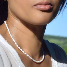 This beautiful, feminine and delicate necklace is crafted from high quality genuine white mother-of-pearl with a beautiful lustre. Worn alone or in combination, it will enhance most of your outfits, whether casual or dressy. As each stone is unique, bracelets in the same series may vary slightly. DIMENSION ∙ 40.5 cm (16 inches), 43 cm (17 inches) ou 45.5 cm (18 inches), clasp included COMPOSITION ∙ Mother-of-pearl ∅ 3 mm (AAA grade, China)  ∙ 925 sterling silver or 14K gold filled beads ∅ 2 mm ∙ Mother Of Pearl Necklace, Unique Bracelets, Matching Bracelets, Delicate Necklace, Spring Rings, Beaded Necklaces, Mother Of Pearl, Necklace Lengths, Gold Filled