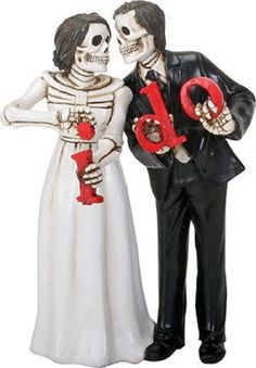 a skeleton bride and groom are holding the letter b to each other in their hands