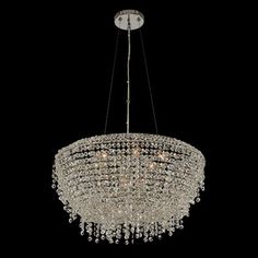 a large chandelier hanging from the ceiling in a dark room with black background