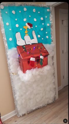 a door decorated to look like a christmas scene