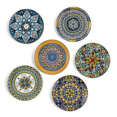 six decorative plates with different designs on them