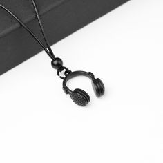 Pick-shaped necklace essential for musicians and music lovers. Developed with the best materials for your comfort! Excellent gift. Perfect gift for Musicians, Guitarists, Singers! Easy adjustment between 19 inches and 27 inches Material: Hypoallergenic 1.5mm black Waxed Cotton Leather Cord | Zamac metal and stainless steel pendant Black Minimalist, Necklace Cord, Gothic Necklace, Treble Clef, Music Gifts, Stainless Steel Pendant, Minimalist Necklace, Waxed Cotton, Leather Cord