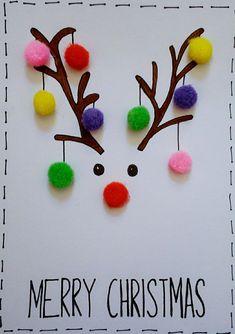 a christmas card with pom - poms and reindeer's nose on it