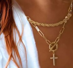 "Looking for the perfect elegant, easy going accessory? We've got you covered with the Paperclip Cross Charm Necklace in 18k Gold Vermeil. Featuring a large paperclip chain and removable cross charm, this elevated necklace lets you easily switch up your look for every day and every occasion. Video shows the Rose Gold version. Available in both 16\" & 18\" lengths. Metal 18k Yellow. Rose and Silver Gold Vermeil What is Vermeil?Vermeil (that's pronounced ver-may) is a gold plating technique that dates back to the 19th century. While other jewelers plate over less durable metals, our vermeil starts with a Sterling Silver base and is plated with just over 2.5 microns of 18k Gold to create a more timeless piece, worthy of the Demi-Fine name." Trendy Gold Cross Jewelry, Cross Charm Necklace, Plating Techniques, Paperclip Chain Necklace, Menlo Park, Art Deco Pendant, Cross Charms, Easy Going, Yellow Rose