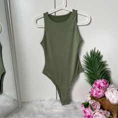 New Basic Green Sleeveless Bodysuit Without Tag Super Stretchy! Snap Button Closure Green Fitted Sleeveless Bodysuit, Fitted Sleeveless Green Bodysuit, Green Sleeveless Bodysuit For Spring, Sleeveless Green Bodysuit For Spring, Trendy Tank Bodysuit For Summer, Trendy Summer Tank Bodysuit, Trendy Green Sleeveless Bodysuit, Trendy Solid Color Sleeveless Bodysuit, Trendy Sleeveless Green Bodysuit