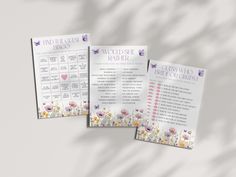 three pamphlets with flowers and butterflies on them