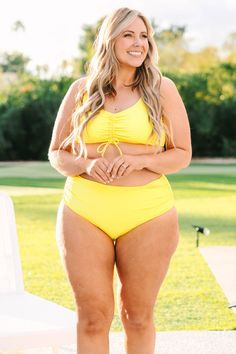 Say talk to the sand when you are wearing this amazing swim top! The yellow color is so chic and the ruching detail has an adjustable tie so you can wear this however you like! Style this cutie with the matching bottoms for a super chic pool look! 82% Polyamide, 18% Elasthane Beachy Ruched Swimwear For Pool, Beachy Ruched Swimwear For The Pool, Ruched Swimwear For Pool And Vacation, Ruched Tie-side Bottom Swimwear For Pool, Ruched Tie-side Swimwear For Pool, Yellow Drawstring Swimwear For Summer, Ruched Swimwear For Poolside Vacation, Poolside Swimwear With Drawstring, Ruched Tankini For Pool Vacation