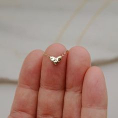 14k Solid Gold Heart Necklace - Small Gold Heart Necklace - Floating Heart Necklace - 14k Gold Heart Choker - Love Necklace Gifts for HerThis dainty 14k solid gold heart necklace is imprinted with water ripples, reminiscent of the sea and just as life giving. It floats quietly upon a sparkling gold chain. As you wear it, remember to take notice of all that's good and golden in your life and let that gratitude wash over you like waves.DETAILS► 14k yellow gold or 14k rose gold by custom request► D Gold Heart Choker, Tiny Heart Necklace, Floating Necklace, Water Ripples, Go With The Flow, Heart Choker, Gold Heart Necklace, Tiny Heart, Yellow Gold Pendants