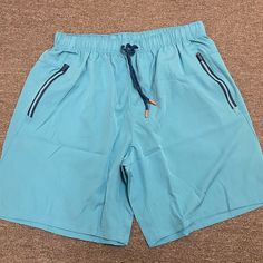 Blue Athletic Shorts Size Large. Brand New And Never Worn. Blue Bermuda Shorts For Poolside, Blue Shorts With Elastic Waistband For Poolside, Blue Poolside Shorts With Elastic Waistband, Blue Sporty Shorts With Pockets, Casual Blue Swim Trunks For Poolside, Blue Casual Swim Trunks For Poolside, Sporty Blue Shorts With Pockets, Blue Shorts With Pockets For Poolside, Blue Shorts With Pockets For Vacation