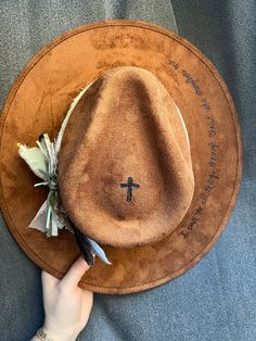 Custom Brown Suede Hat Size 55-57 cm Stiffened brim. Inner Elastic Band. No adjustable strings.  4" Crown Height 3.25" Brim  After ordering, we will send you a message to confirm personalization and to send pictures of your order in case any changes need to be confirmed before shipping.  Each hat is unique and our accessories vary so that no two hats are ever exactly alike. However, we try to match the exact design you choose.  Hand written messages, Branded symbols, Branded letters, Branded numbers can be placed anywhere on the hat for an additional charge of $5 per letter. Please let us know if you'd like to add anything Personalized Cowboy Hat, Country Style Wide Brim Felt Hat For Beach, Adjustable Brown Boater Hat With Flat Brim, Adjustable Brown Hat With Curved Brim, Adjustable Wide Brim Felt Hat For Country Events, Adjustable Country Style Fedora Felt Hat, Adjustable Brown Mini Hat With Short Brim, Brown Adjustable Mini Hat With Short Brim, Country Style Adjustable Fedora With Curved Brim