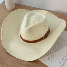 Discover the Perfect Blend of Style and Functionality Step out in style this summer with our New Design Natural Paper Western Cowboy Hat. Whether you're heading to the beach, a music festival, or just enjoying a sunny day outdoors, this hat is your ultimate accessory. Crafted with a blend of natural paper and polyester, it offers a lightweight and breathable fit, making it ideal for warm weather. Versatile and Unisex This cowboy hat is designed for both men and women, offering a unisex appeal that fits seamlessly into any wardrobe. Its solid pattern and casual style make it a versatile piece that complements any outfit, whether you're going for a laid-back beach look or a more polished summer ensemble. Key Features Material: Natural paper and polyester for a lightweight, breathable feel. B Casual Straw Hat, Cowboy Hat Styles, Chapeau Cowboy, Natural Paper, Western Cowboy Hats, Straw Sun Hat, Sun Cap, Straw Hats, Sun Hats For Women