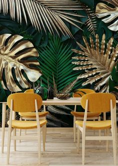 a dining room with tropical wallpaper and chairs