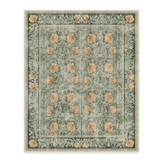 a green and beige rug with flowers on the bottom, in an ornate pattern that looks like