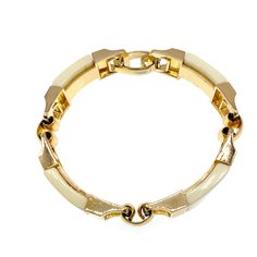 A gorgeous Christian Dior 1972 bracelet. The bracelet is made of up four individual links each with a cream curved bead fixed inside a gold plated setting.  It is all linked together with independent links allowing free movement in the bracelet. The clasp is a secure fold over snap lock clasp that is signed '1972 © Chr Dior Germany'.  This is a lovely piece, classic and stylish.  It comes with its original box.  This piece is in lovely vintage condition. Measurements: 18.5cm in length by 1.2cm w Snap Lock, Hippie Bracelets, Enamel Necklaces, Statement Bracelet, Gorgeous Bracelet, Vintage Jewellery, Original Box, Christian Dior, Faux Pearl