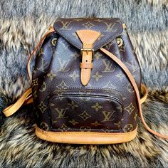 Authentic, Pre-Loved Louis Vuitton Monogram Montsouris Backpack Mini. Features Monogram Canvas With Leather Trim, Front Zippered Pouch, Top String Closure With Buckle Front Flap, The Interior Has A Brown Textile Lining With D Ring, Adjustable Shoulder Straps. This Bag Is Perfect For Shopping, Travel, School, And Hands-Free Needs. Condition: Gently Used Exterior Scuffs Or Marks. The String Is New But Has Paint On The Other End. Grommets Are Strong And In Place, Straps Are Strong At The Base, Leather Trim On Lips Has Some Rubbing Which Is A Normal Sign Of Use, Overall Normal Leather Aging From Use, Pretty Honey Patina Coloring, The Interior Is Clean With Some Signs Of Use And, Patina Colori Louis Vuitton Bookbag, Louis Vuitton Watercolor, Montsouris Backpack, Palm Springs Mini Backpack, Louis Vuitton Backpack, Monogram Backpack, Rucksack Bag, Louis Vuitton Empreinte, Vintage Backpacks