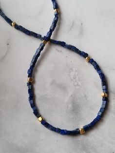 The dainty Lapis Lazuli necklace features 24k gold filled beads and is designed as a genuine natural Lapis Lazuli choker, making it an exquisite gemstone necklace perfect for those born under the Sagittarius zodiac sign, as it incorporates their birthstone. You will receive 1 necklace. 👀Discover Similar Dainty Jewelries https://www.etsy.com/shop/demetergemart/?etsrc=sdt§ion_id=44637022 ✨MATERIALS The gemstones are Lapis lazuli. The cube beads are 24k gold filled. The lobster claw clasp, extensi Sagittarius Zodiac, Lapis Lazuli Necklace, Cube Beads, Zodiac Sagittarius, December Birthstone, Dainty Jewelry, Gemstone Necklace, Lapis Lazuli, Lobster Claw