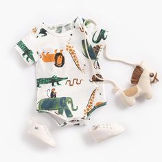 Keep your little one stylish and comfy in this adorable Baby Cartoon Bodysuit. Crafted with soft and breathable fabrics, it's a must-have for your child's wardrobe. With its vibrant designs, it will add a splash of color to any outfit! Introducing Lenny Lemons Baby Cartoon Bodysuit, the ideal choice for sunny adventures. Adorned with adorable cartoon prints, these bodysuits bring a smile to your baby girl's face. Crafted from breathable cotton, these short-sleeved bodysuits keep your baby comfy Unisex Playful Onesie For Loungewear, Cute Cartoon Print Summer Bodysuit, Unisex Casual Short Sleeve Bodysuit For Playwear, Casual Printed Onesie For Loungewear, Casual Printed Loungewear Onesie, Casual Printed Fitted Short Sleeve Bodysuit, Playful Bubble Romper For Playtime, Casual Fitted Printed Short Sleeve Bodysuit, White Dinosaur Print Summer Sets