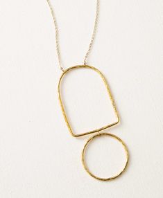 This striking silhouette necklace is hand formed and features a hammered brass pendant. Noonday Collection, Silhouette Necklace, Bracelet Kits, Hammered Brass, Holiday Gift Sets, Gift Of Time, Book Candle, Craft Accessories, Brass Pendant