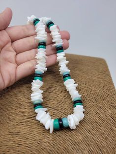 "White & Turquoise Puka shell Necklace. Handmade with white seashell and Turquoise color wooden beads and black wooden beads 18\" Inches Around the neck Handmade Design. Necklace is Unisex Fits Most Sizes FAST SHIPPING! *First Class Mail* Visit my Etsy Shop to see more Designs! Handmade Earrings, Puka Shell Bracelets and Puka Shell Necklaces. Click here to see more designs: https://www.etsy.com/shop/FreedomLifeStyle" White Bohemian Turquoise Necklace As Gift, Bohemian White Turquoise Necklace As Gift, Handmade Adjustable White Turquoise Necklace, Adjustable White Turquoise Necklace With Natural Stones, Bohemian Style Turquoise Gemstone Beads Necklace, Bohemian White Turquoise Gemstone Beads Necklace, Bohemian White Turquoise Necklace With Natural Stones, White Turquoise Necklace With Natural Stones, Adjustable, Turquoise Round Beads Shell Necklace For Vacation