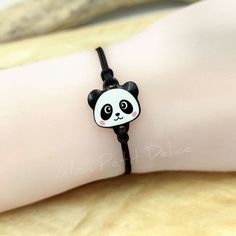 Adjustable cord bracelet Panda Bear Kawaii handmade with shrink plastic and covered with resin ... As all of our products are handmade with all our love and dedication, all of them are one of a kind. The bracelet is waterproof. Adjustable with macramé sliding knot, which makes it easy to put it on and take it off. The bracelet is finished with two steel balls, completely hypoallergenic. You'll find it available in other options, so make sure to check out this link : https://www.etsy.com/shop/Mon Adjustable White Jewelry With Cute Design, White Jewelry With Cute Adjustable Design, Playful Adjustable Friendship Bracelets As Gift, Adjustable Jewelry With Cute Design Gift, Playful Adjustable Friendship Bracelets For Gifts, Playful Handmade Friendship Bracelets For Everyday, Novelty White Friendship Bracelets As Gift, White Waxed Cord Bracelet Perfect For Gifting, White Waxed Cord Bracelets For Gifts