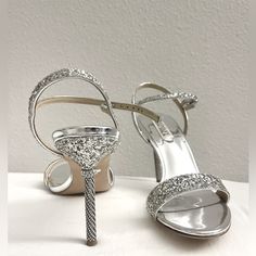 Brand New With Tags, Bought At Nordstrom Rack Beautiful Open Toe Heels With Silver Mirror Like Finish And Rhinestone On All Straps. Features Unique Heel With Rhinestone Ring Around It. Never Worn. Size 38.5 Unique Heels, Badgley Mischka Shoes, Open Toe Heels, Rhinestone Ring, Silver Mirror, Silver Rhinestone, Silver Mirrors, Badgley Mischka, Strap Heels