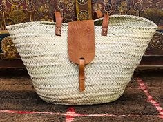 "straw bag Handmade French Basket - Natural Basket long Flat Leather Handle  Handmade and so are completely unique and very slightly different in size A classic French-style Market Basket with short Flat Leather Handle and sculptured base. Can be carried in the hand or on the elbow. A smaller basket suitable for shopping or hampers 🌟      🌸 DETAILS 🌸 Raw Material : 100% Woven natural palm straw, wild palm doumdoum eco friendly 😊 Trim : 100% Vegan Leather, Removable canvas pouch with a zip top closure size : 49 x 30 x 30 cm = 19.2 x 11.8 x 11.8 inches       🌸 SHIPPING 🌸 We USE FEDEX EXPRESS \"Door to Door\". for your convenience,Your order will be processed within 2-3 business days anywhere in the world.. Please also know that although every effort is made to photograph our work accur Traditional Woven Leather Straw Bag For The Beach, Traditional Woven Leather Straw Bag For Vacation, Traditional Straw Travel Bag, Eco-friendly Basket Beach Bag With Braided Handles, Basket-shaped Beach Bag In Woven Leather, Elegant Basket-shaped Bucket Bag With Braided Handles, Basket-shaped Straw Bag With Bamboo Handle, Moroccan Basket, Bohemian Basket-shaped Natural Bucket Bag