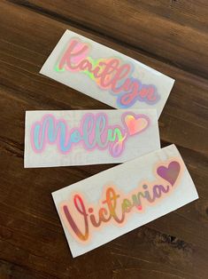 two stickers with the words hello kitty and i love you written in different colors