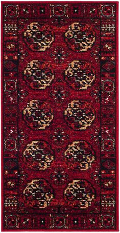 a red rug with black and gold designs on it