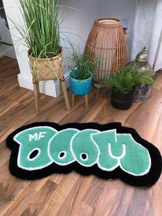 a black and green rug with the word boo on it