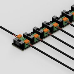 four wires connected to each other with orange and black connectors on top of them