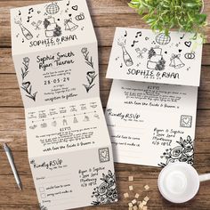 the wedding stationery is laid out on top of a wooden table next to a potted plant