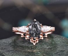 an engagement ring with two pear shaped diamonds