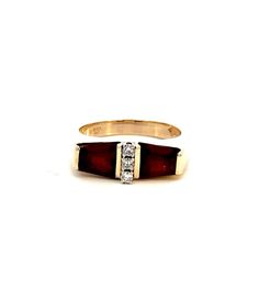 Elevate your jewelry collection with the exquisite beauty of our 14KT Yellow Gold Garnet Ring with Diamonds. This magnificent piece showcases a unique and captivating design, featuring two radiant garnet stones set in the warmth of lustrous 14KT yellow gold. The garnets, known for their deep red hue that symbolizes love and passion, are beautifully complemented by a vertical row of three round diamonds, adding a touch of sparkle and sophistication to the piece. The ring's design is a testament to expert craftsmanship, blending classic elegance with a modern flair. The contrast between the rich red of the garnets and the bright sparkle of the diamonds creates a stunning visual appeal, making this ring a perfect choice for those who appreciate fine jewelry with a distinctive character. With Luxury Red Three Stone Jewelry, Luxury Red Three-stone Jewelry, Formal Garnet Three-stone Rings, Formal Three Stone Garnet Rings, Formal Three Stone Garnet Jewelry, Formal Three-stone Garnet Rings, Gold Garnet Ring, Garnet And Diamond Ring, Garnet Ring