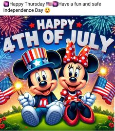 two mickey and minnie mouses are celebrating the fourth of july with fireworks in the background