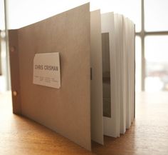 an open book sitting on top of a wooden table