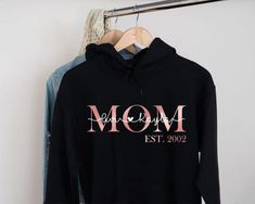 "Mama Est Hoodie, Mom Established, Custom Year, Personalized Mama Sweater, New Mom To Be Gift, Unisex Hoodie, Mama Sweatshirt With Kids Names H O W T O O R D E R 1. Simply select the size of your hoodie individually and then click \"Add to Cart\" 2. Repeat each step for each hoodie that you need. Add as many as needed to your cart and then proceed to checkout. 3. Submit order ♥ The items are printed after the payment has been cleared within 1-3 business days, sometimes faster. This is the time w Mother Daughter Shirts, Mama Sweater, Honeymoon Shirts, Mommy And Me Shirt, Mom Hoodies, Kids Names, Mom To Be, Mommy And Me Outfits, Mama Sweatshirt