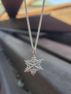 ❄️In stock and can ship immediately!❄️  Be as unique as a snowflake with this wintery necklace! This sweet sterling silver snowflake pendant is absolutely lovely.  Available with and without a sterling silver 18-inch 1.2 mm French rope chain. This is a part of our snowflake collection- check out our coordinating stud and dangle earrings too! Snowflake Necklace Silver, Silver Snowflake Jewelry For Christmas, Sterling Silver Snowflake Jewelry, Silver Snowflake Sterling Silver Jewelry, Silver Sterling Snowflake Jewelry, Holiday Sterling Silver Necklaces, Holiday Sterling Silver Necklaces In Silver, Nickel-free Silver Necklaces For Christmas, Nickel-free Silver Necklace For Christmas