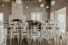 a large room with tables and chairs set up for a formal function at the reception