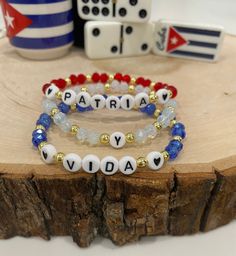 Patria y Vida bracelets, SOS CUBA, Supporting Cuba, Viva Cuba Libre *Made and shipped from USA* These are super stylish, comfortable and perfect for daily wear! (These are meant to fit snug. If you would like them to feel loose and move around on your wrist, please size up). Each bracelet is carefully handmade with high quality materials: -6mm crystal beads (Solid or clear) -3mm gold hematite beads -7mm acrylic letter beads -Elastic Cord: high-quality, durable, stretch cord with reinforced knots Personalized Adjustable Beaded Bracelets As Souvenir, Stackable Beaded Bracelets With Round Beads As Personalized Gift, Handmade White Beaded Bracelets As Souvenir, Viva Cuba, Bracelets Beaded, Wood Bead Bracelet, Sister Jewelry, Word Bracelet, Acrylic Letters