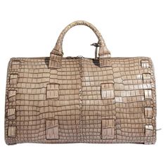 Spacious enough for long weekends away, this pre-owned Bottega Veneta holdall has been crafted in Italy from prime leather in neutral tones. The bag features two leather top handles in the house's signature intrecciato weave, which was first developed as a way of strengthening the hide to ensure longevity. Its flawless fabrication guarantees that it will outlast even your greatest adventures and travels. Bottega Veneta Bags, Crocodile Bags, Leather Duffle Bag, Leather Duffle, Prada Crossbody, Prada Crossbody Bag, Diaper Backpack, Casual Backpack, Neutral Tones